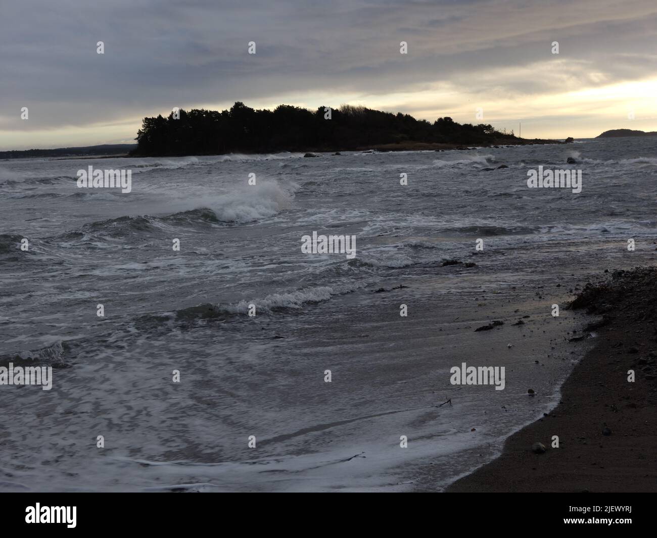 Strong waves, after the storm, which wash over the beach. Stock Photo