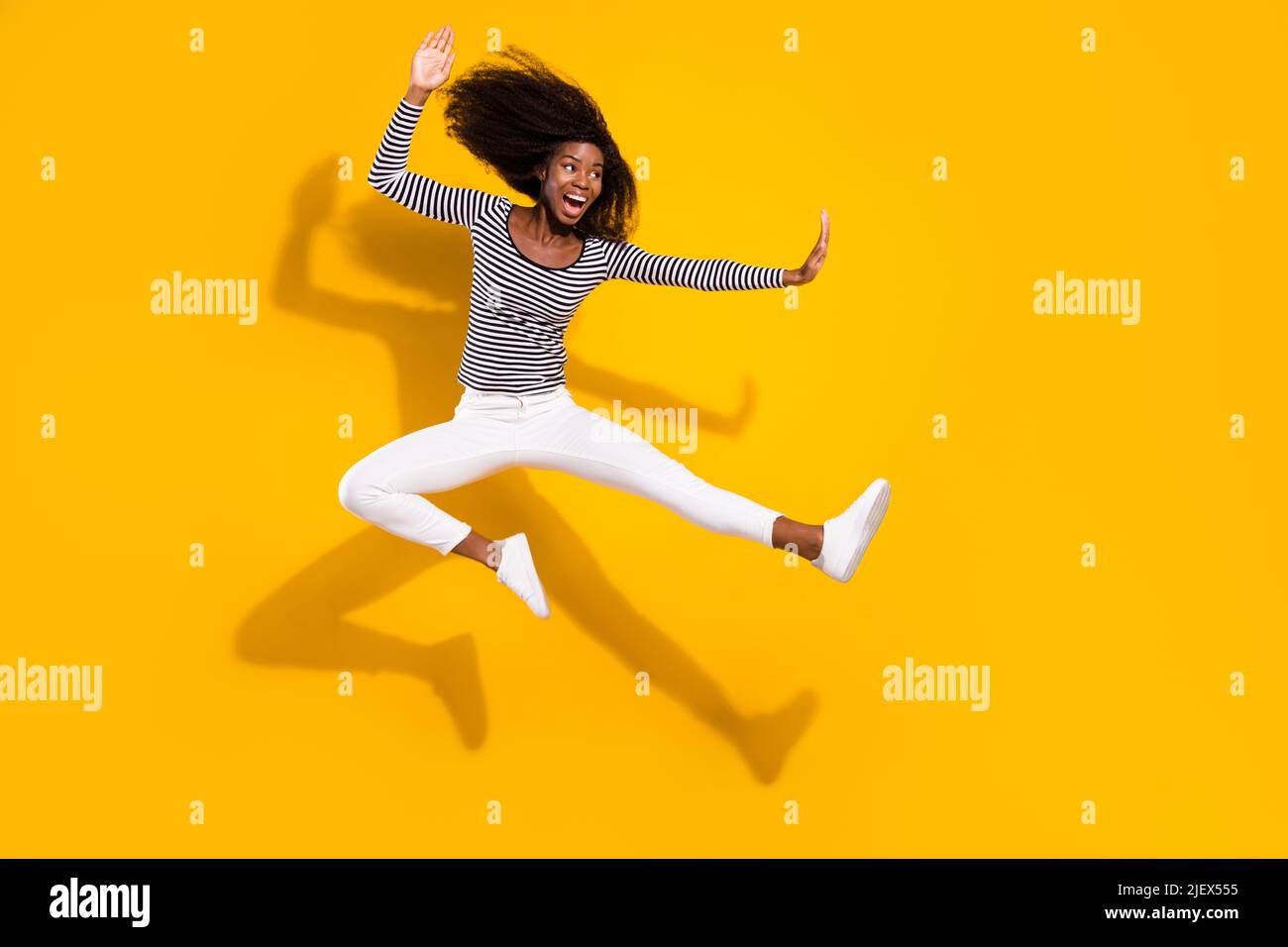 Full length body size photo woman in white pants practicing karate