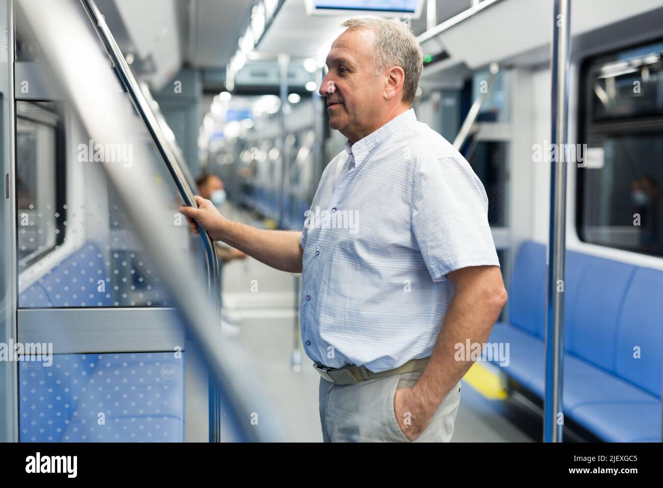 Pensioner 60 year old rides in an subway car Stock Photo