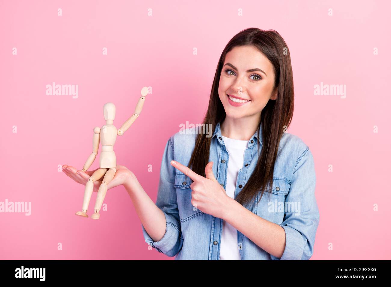 smiling female puppeteer holding male marionette isolated on grey Stock  Photo - Alamy