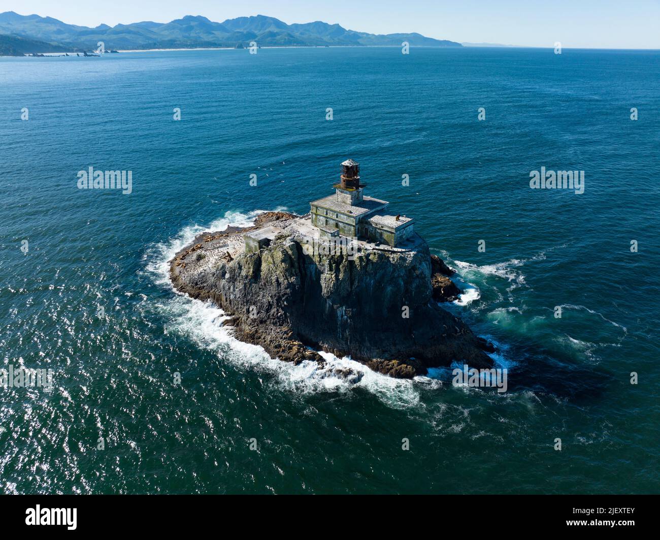 The Pacific Ocean surrounds the deactivated Tillamook Rock Lighthouse off the scenic Oregon coast. The historic lighthouse was built in 1880. Stock Photo