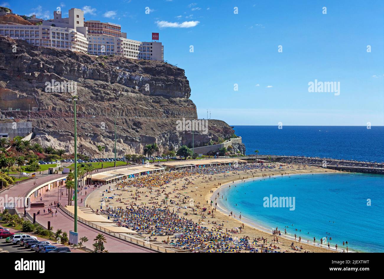 Holidaymakers on Playa de los Amadores, bathing beach close to Puerto Rico, Grand Canary, Canary islands, Spain, Europe, Atlantic ocean Stock Photo