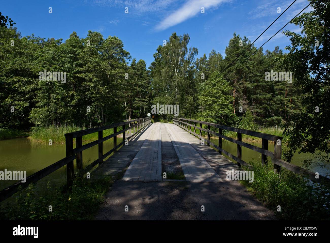 Wooden bridge over water in the summer at Medvastö, Kirkkonummi, Finland. Stock Photo