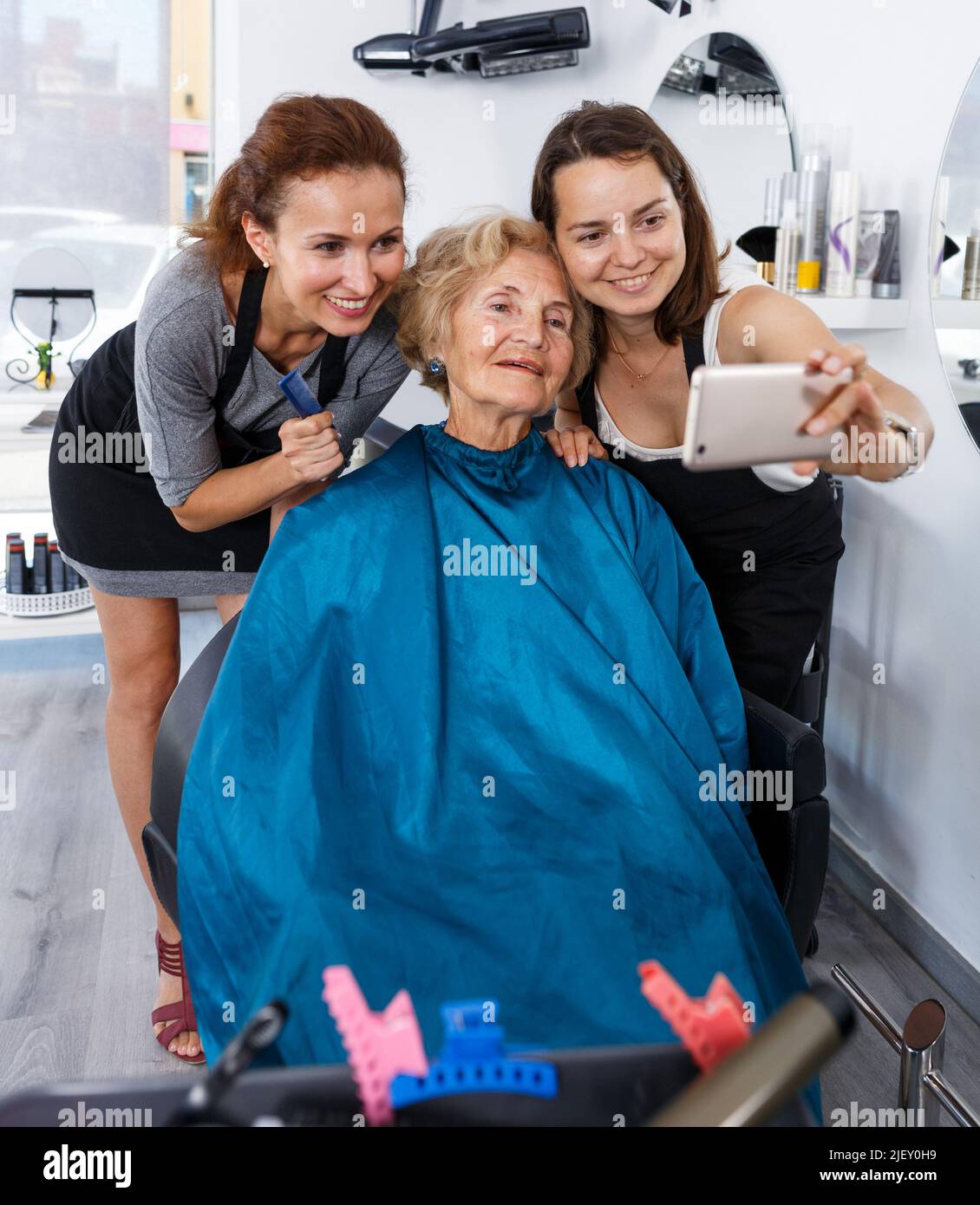 Female hair stylist finishing hi-res stock photography and images - Alamy