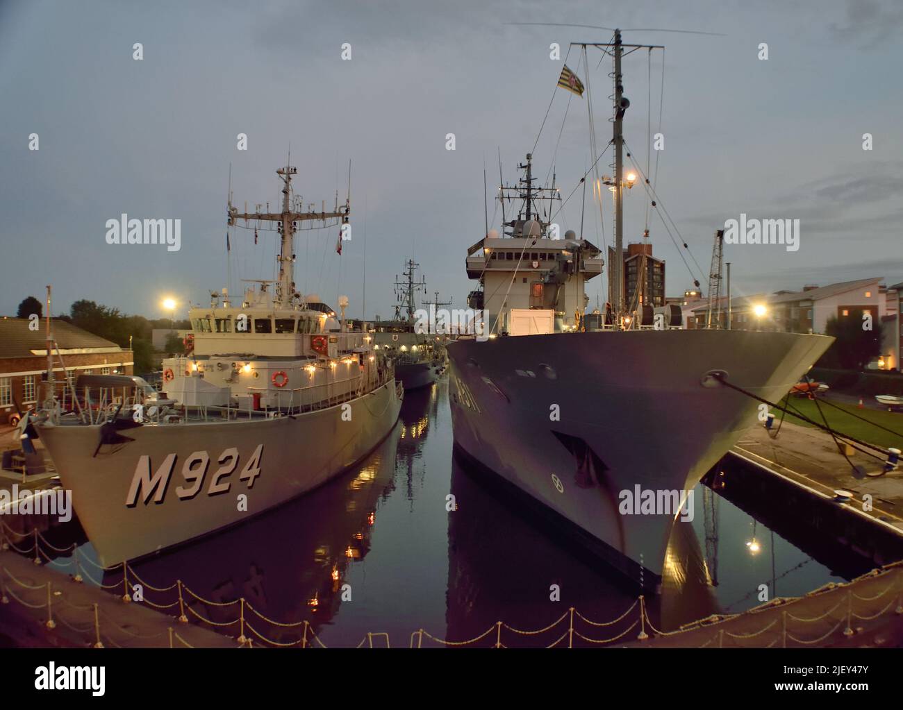 Nighttime shot of vessels of NATO's SNMCMG1  moored in the KGV Lock in London Stock Photo
