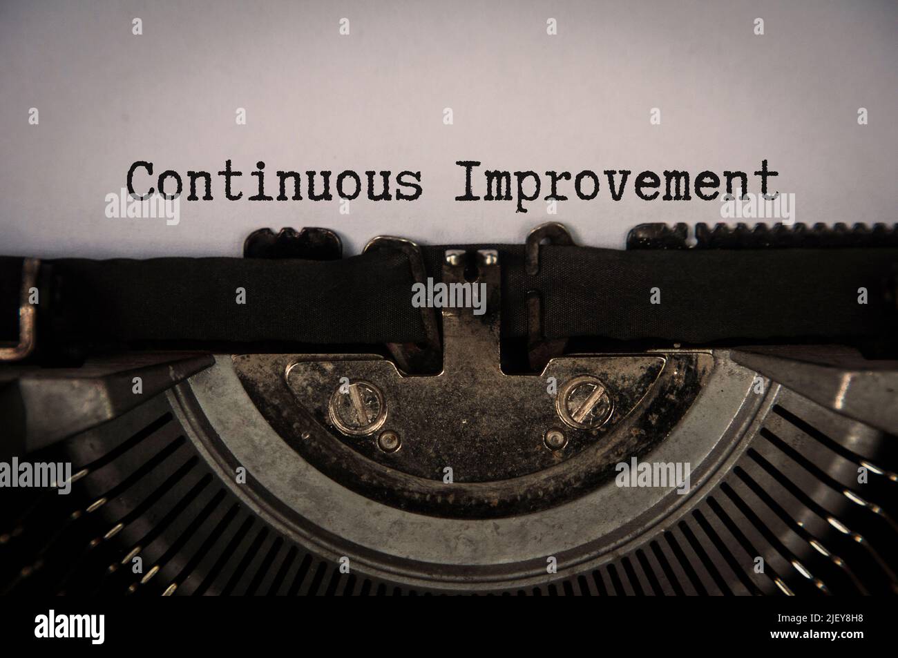 Continuous improvement text on an old typewriter in vintage color ...