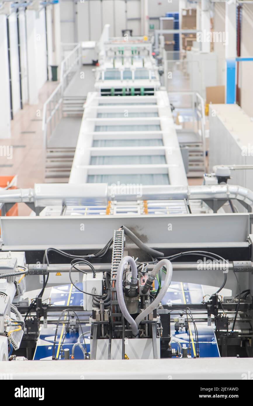 Close up detail of industrial machinery at work in a production line ...