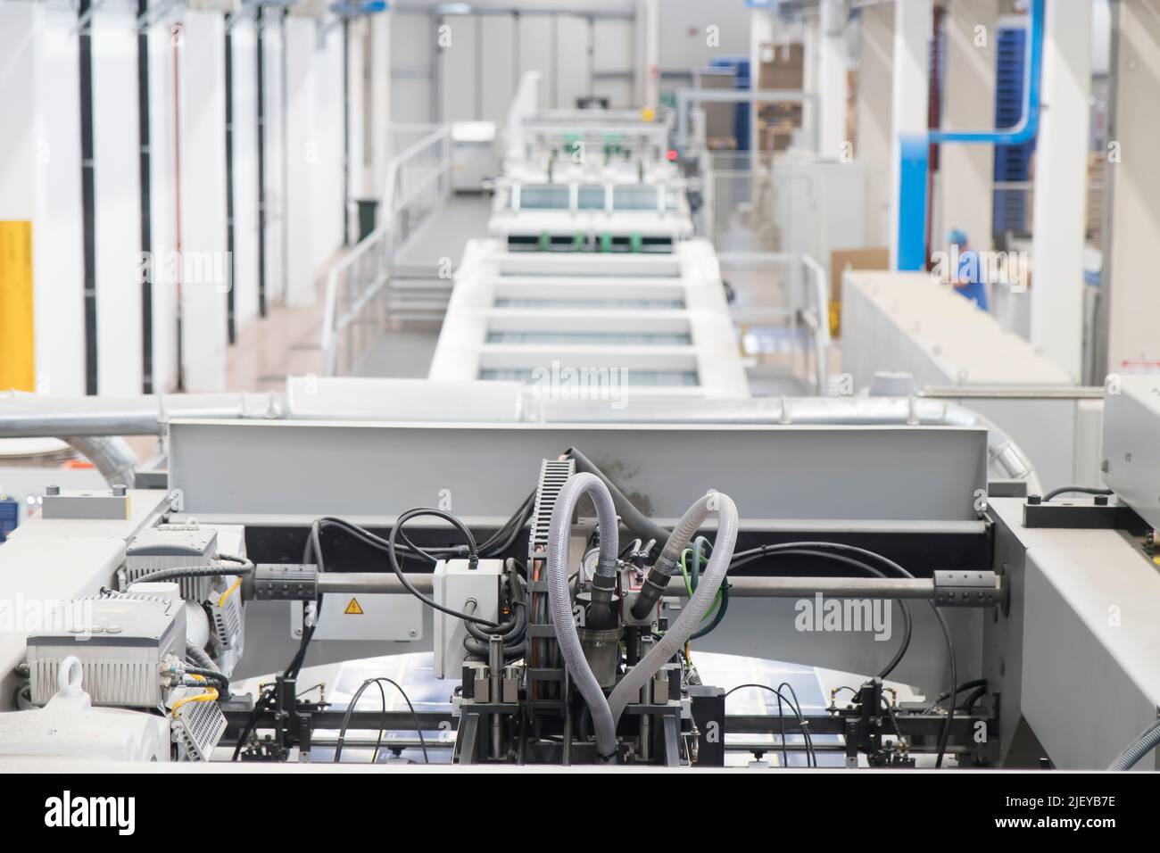 Close up detail of industrial machinery at work in a production line ...