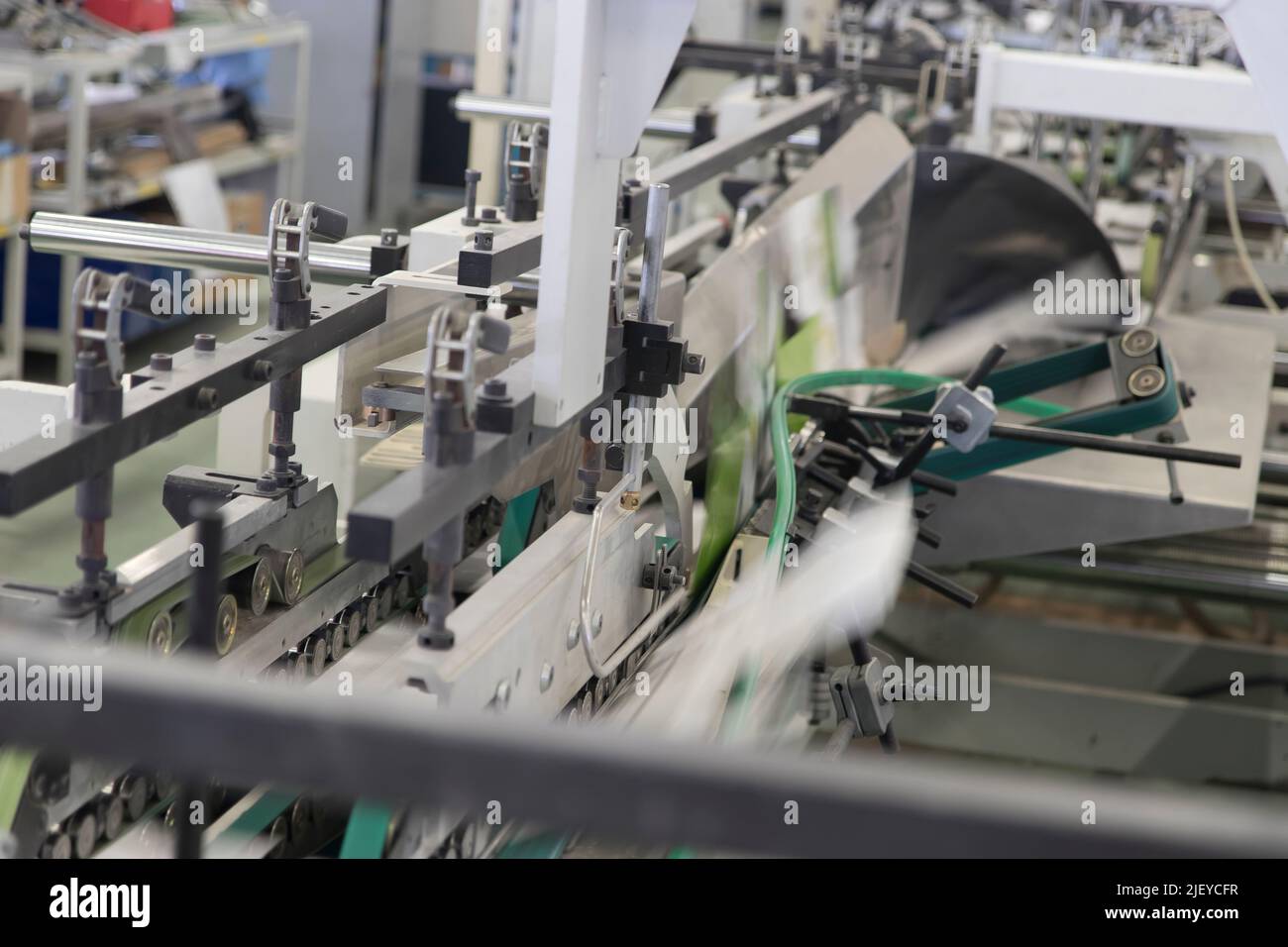 Close up detail of industrial machinery at work in a production line ...
