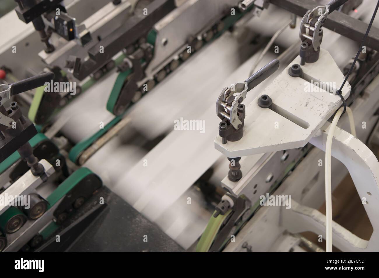 Close up detail of industrial machinery at work in a production line ...