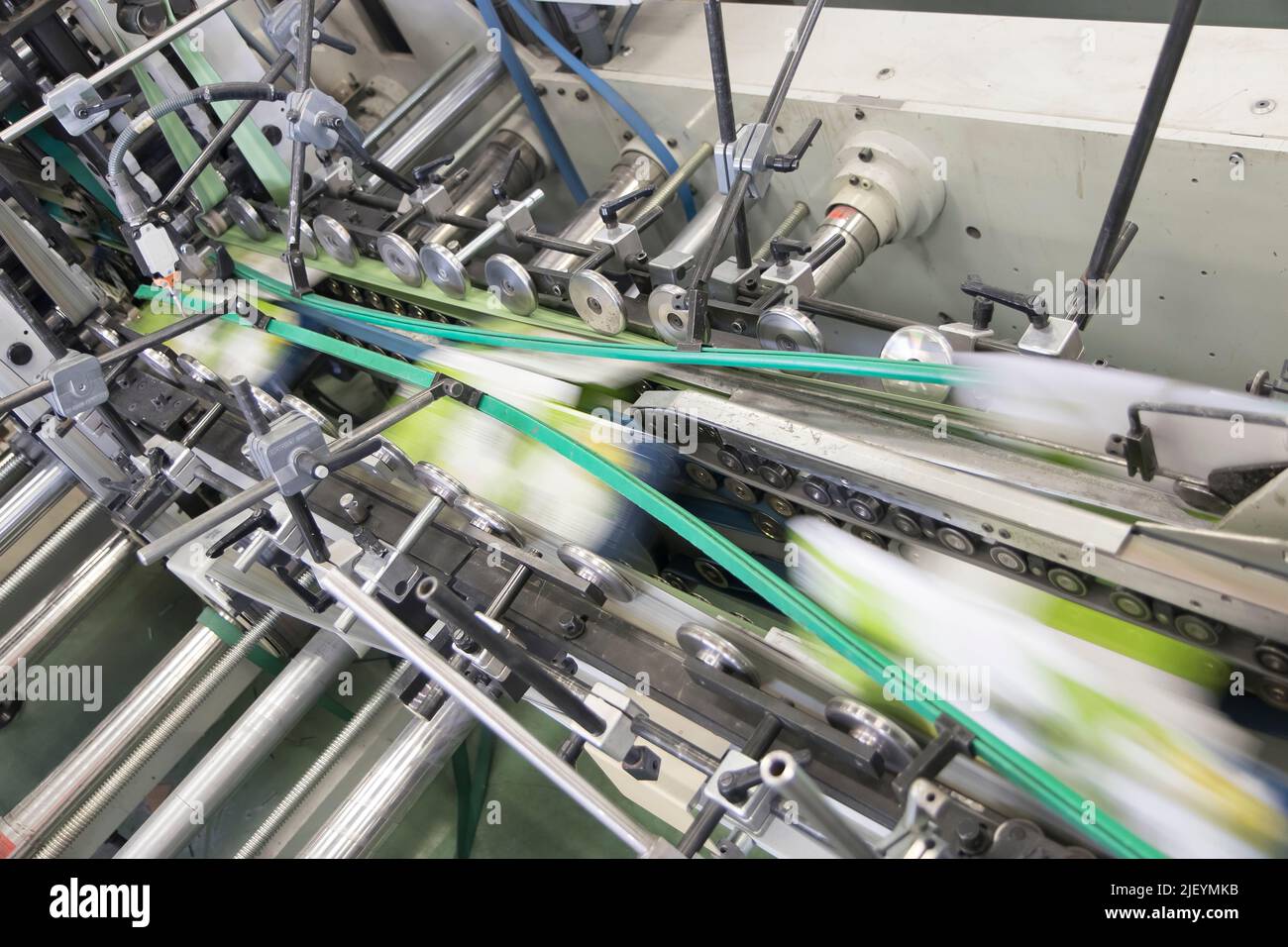 Close up detail of industrial machinery at work in a production line ...