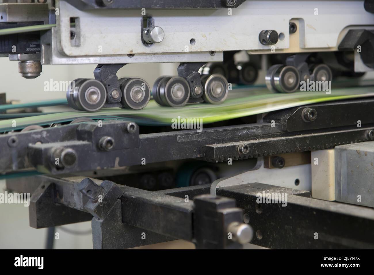 Close up detail of industrial machinery at work in a production line ...