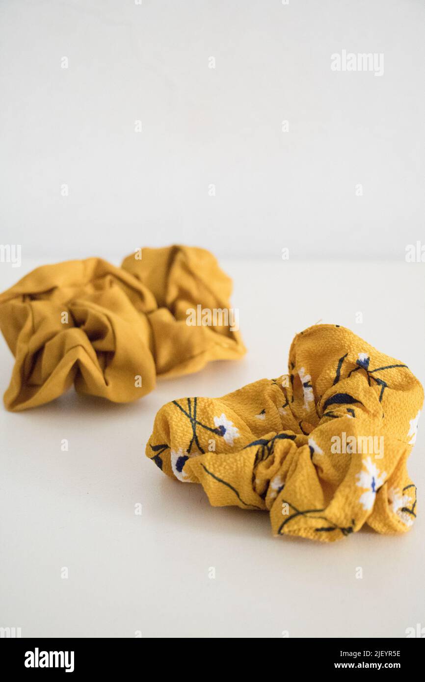 two yellow hair scrunchies Stock Photo