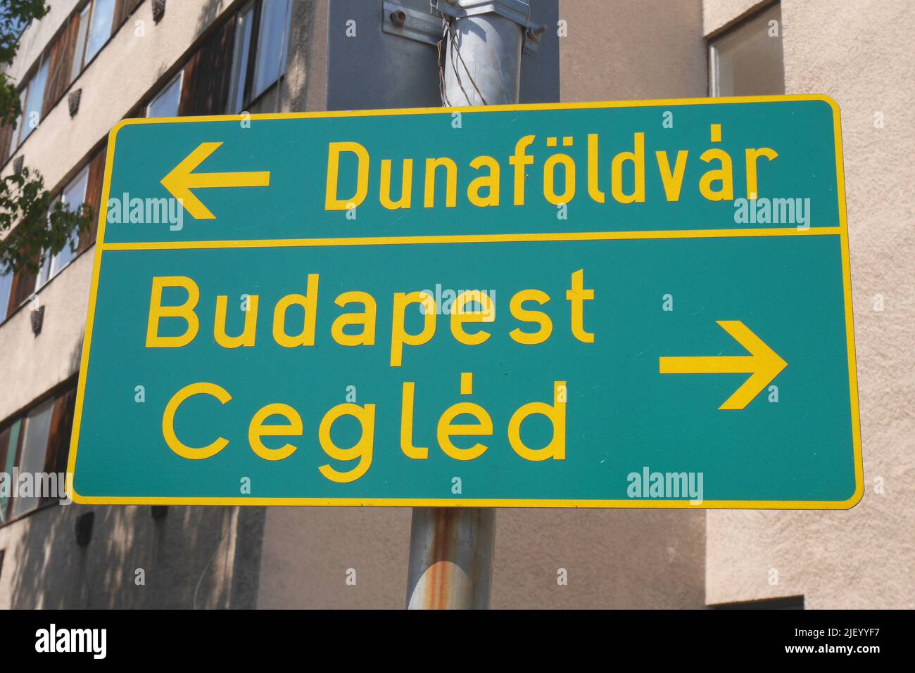 Road sign pointing to Dunafoldvar, Budapest and Cegled, Kecskemet, Hungary Stock Photo