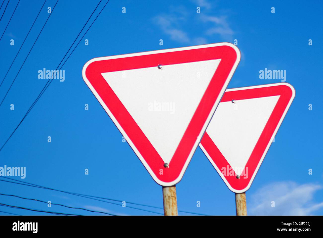 Dangerous turns, warning traffic sign isolated on white background Stock  Photo - Alamy