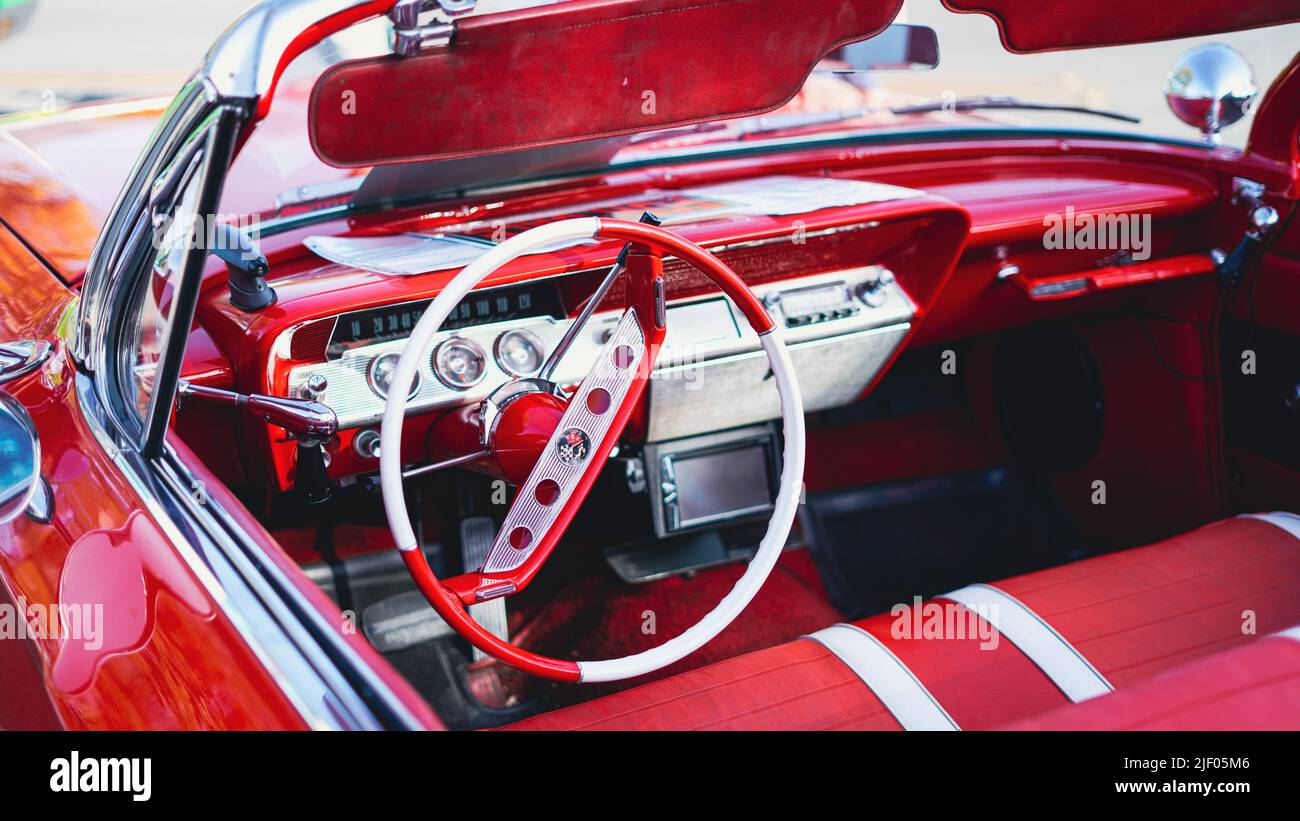 A red cabriolet Chevrolet impala in a classic car show in Santa Paula