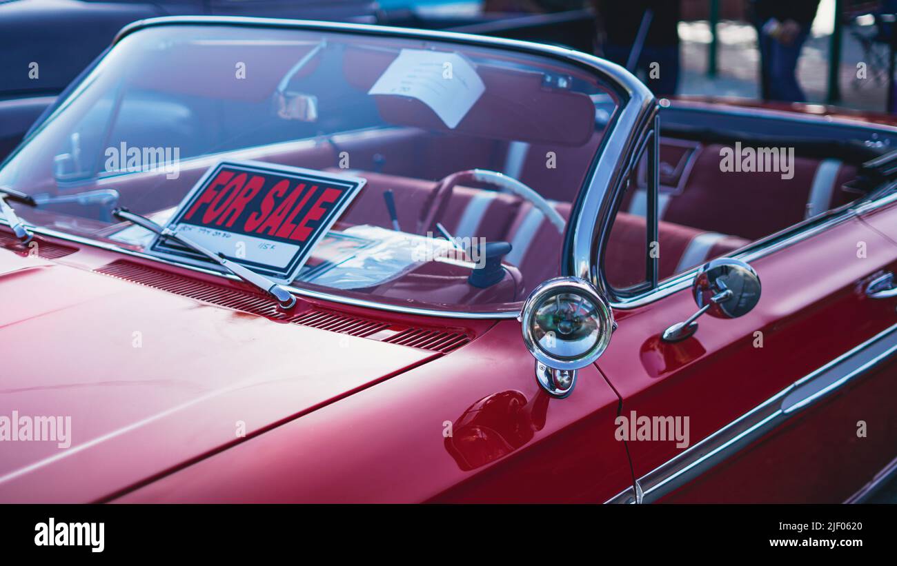 A red cabriolet Chevrolet impala in a classic car show in Santa Paula