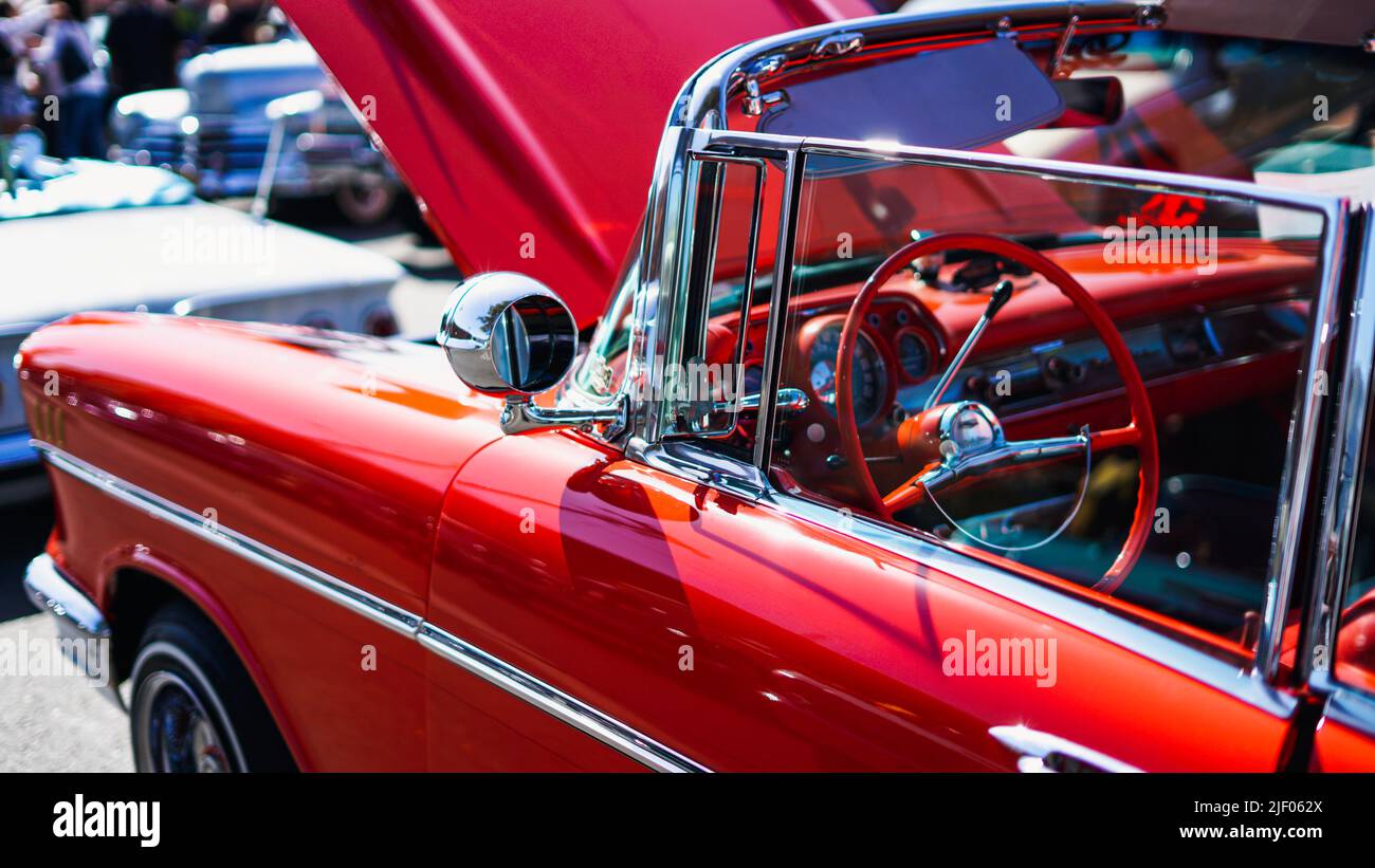 A red cabriolet Chevrolet impala in a classic car show in Santa Paula
