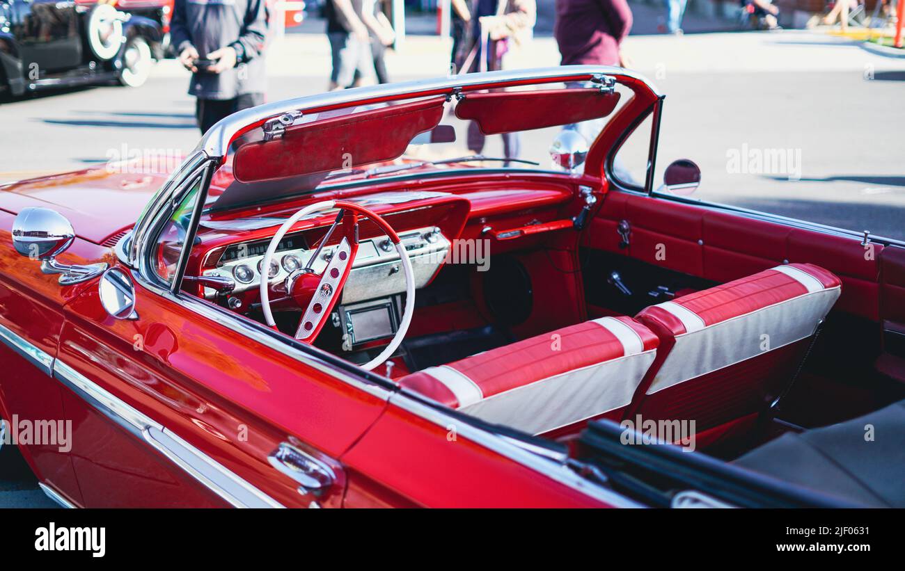 A red cabriolet Chevrolet impala in a classic car show in Santa Paula