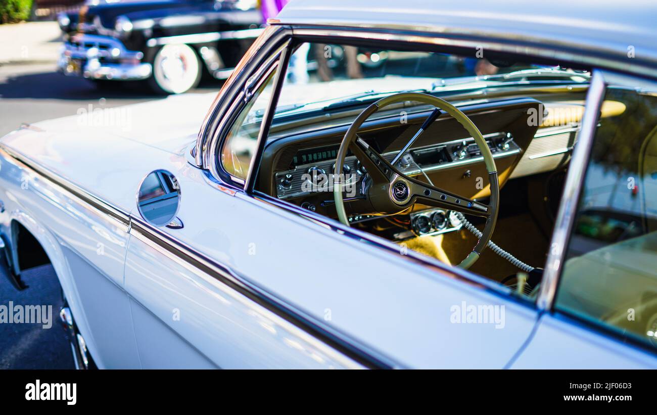 A light blue Chevrolet impala in a classic car show in Santa Paula