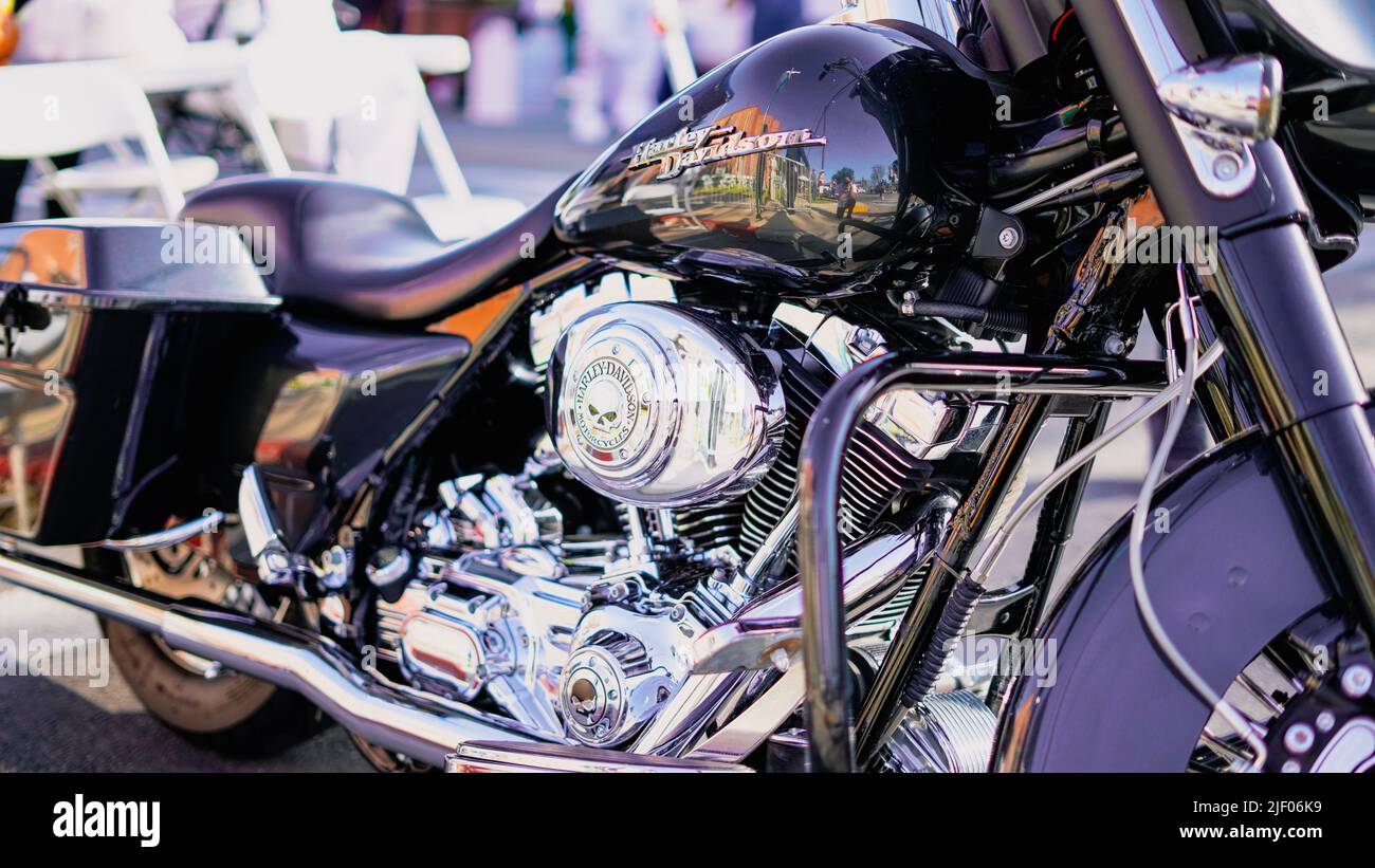 A dark HarleyDavidson in a classic car show in Santa Paula California