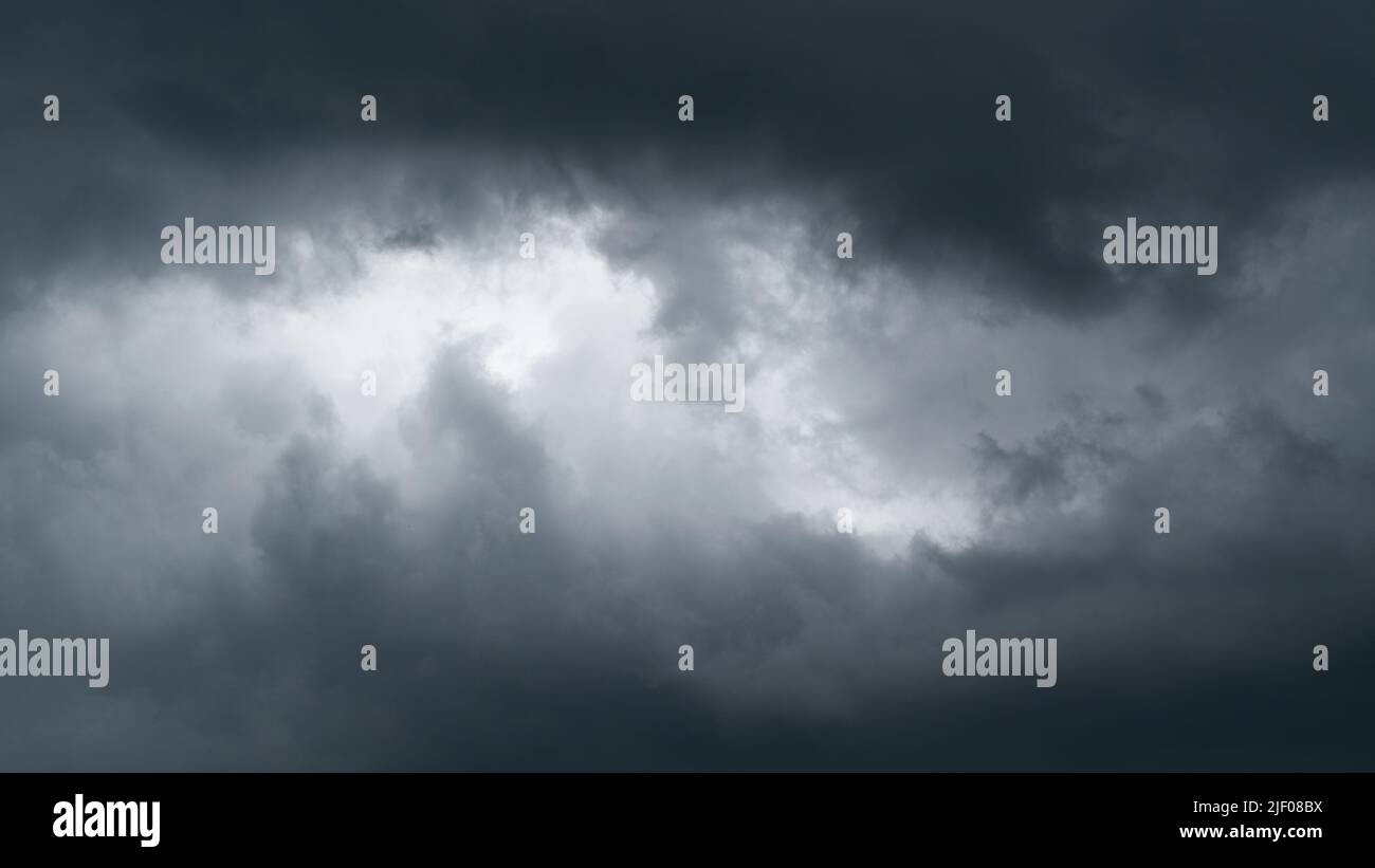 Dark moody clouds panorama, ominous weather Stock Photo