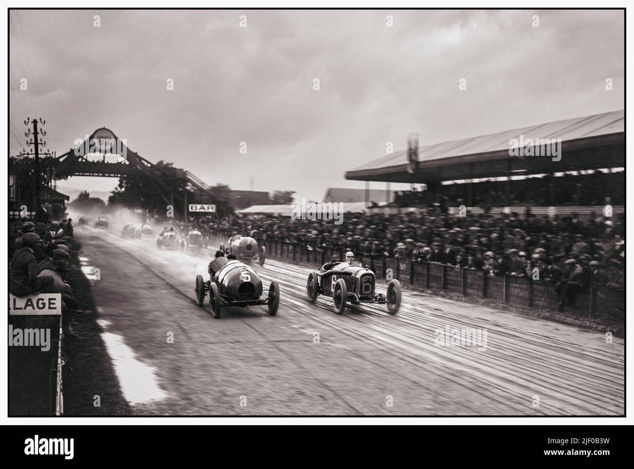 1922 French Grand Prix start on a dull overcast wet day.  The 1922 French Grand Prix (formally the XVI Grand Prix de l'Automobile Club de France) was a Grand Prix motor race held at Strasbourg on 15 July 1922. The race was run over 60 laps of the 13.38km circuit for a total distance of just over 800km and was won by Felice Nazzaro driving a Fiat. This race is notable as the first Grand Prix to feature a massed start. Stock Photo