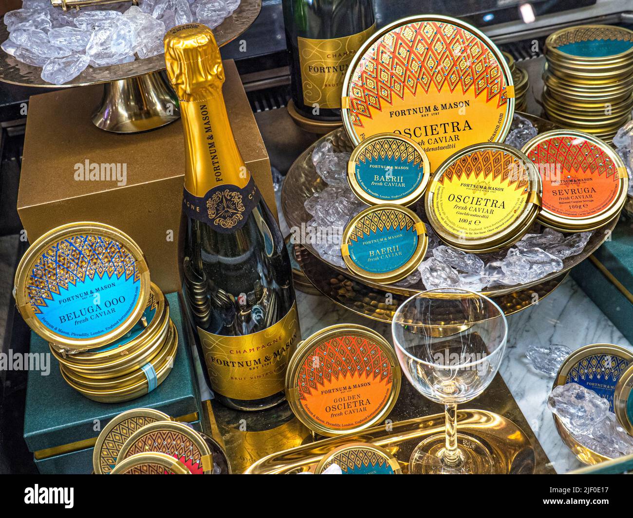 RUSSIAN CAVIAR CHAMPAGNE ON SALE DISPLAY Fortnum & Mason Food Hall with cabinet display of Fortnum branded Caviar varieties Beluga Oscietra Sevruga, Stock Photo