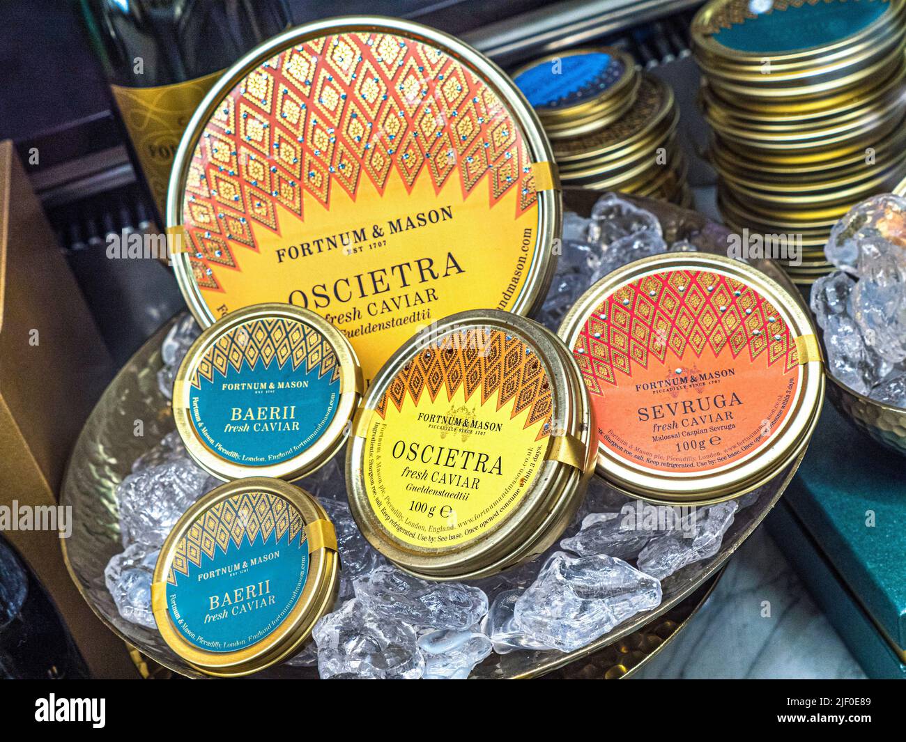 CAVIAR RUSSIAN VARIETIES ON SALE DISPLAY Fortnum & Mason Food Hall with cabinet display of Fortnums branded Caviar varieties Beluga Oscietra Sevruga.. Stock Photo