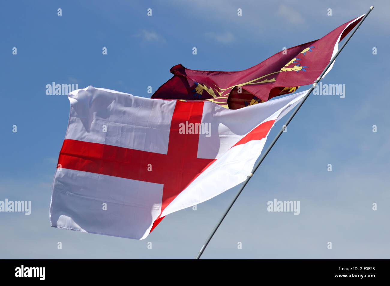 Flags of England: Saint George's Cross and Three gold lions, a Royal Banner of England Stock Photo