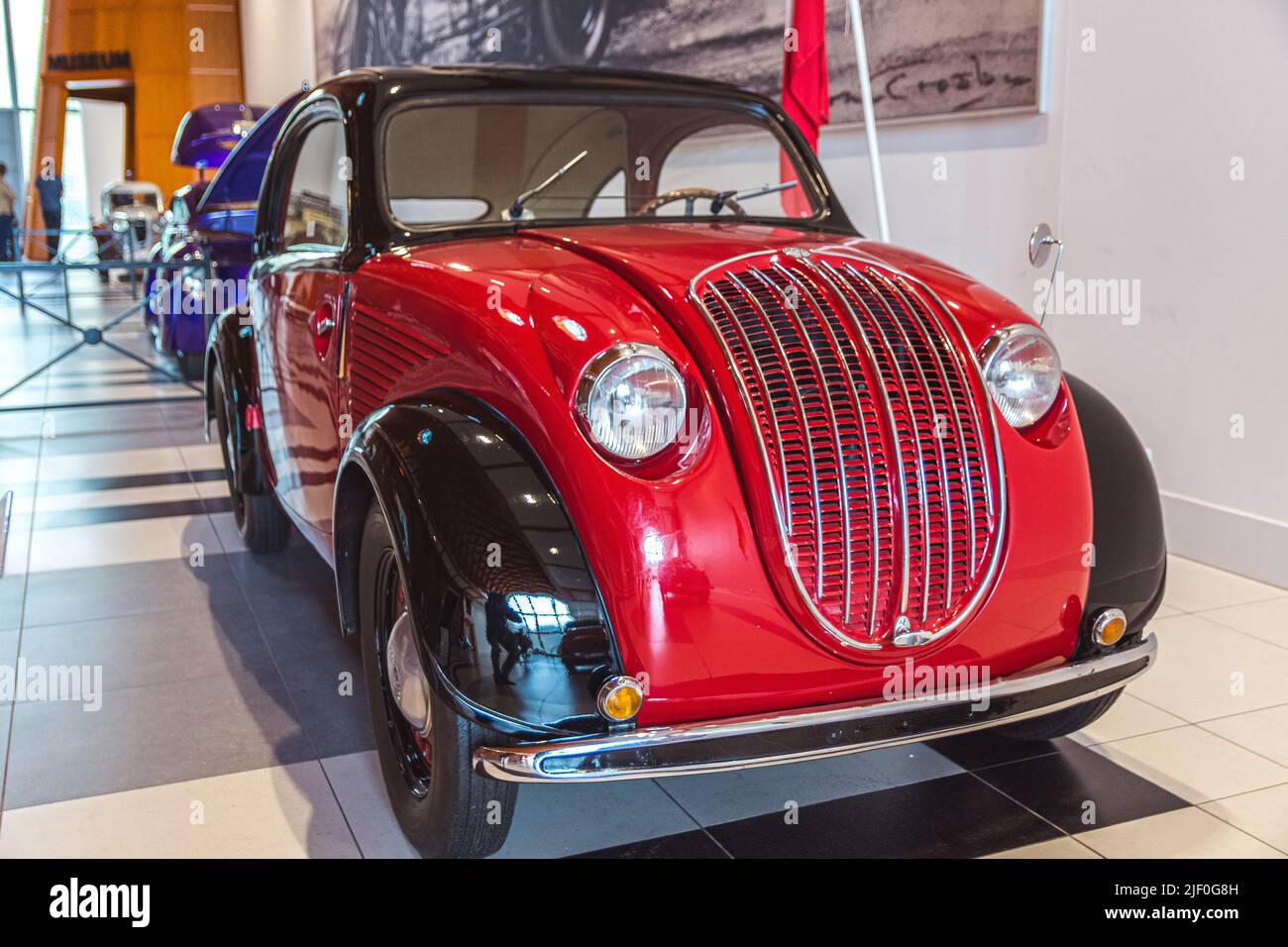 Very old car showed in the museum. Steyr 55 bicolor, red and balck Stock Photo