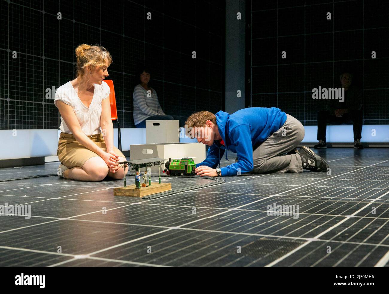 Niamh Cusack (Siobhan), Luke Treadaway (Christopher Boone) in THE CURIOUS INCIDENT OF THE DOG IN THE NIGHT-TIME by Simon Stephens at the Apollo Theatre, London W1  12/03/2013  a National Theatre production  adapted from the novel by Mark Haddon  design: Bunny Christie  lighting: Paule Constable  video design: Finn Ross  director: Marianne Elliott Stock Photo