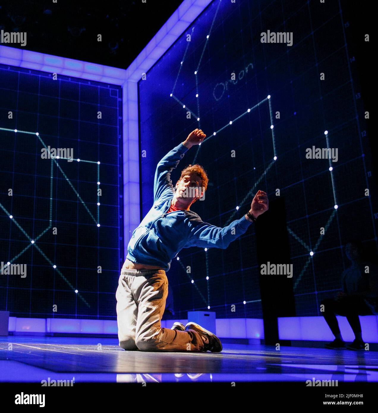 Astro Boy: Luke Treadaway (Christopher Boone) in THE CURIOUS INCIDENT OF THE DOG IN THE NIGHT-TIME by Simon Stephens at the Apollo Theatre, London W1  12/03/2013  a National Theatre production  adapted from the novel by Mark Haddon  design: Bunny Christie  lighting: Paule Constable  video design: Finn Ross  director: Marianne Elliott Stock Photo