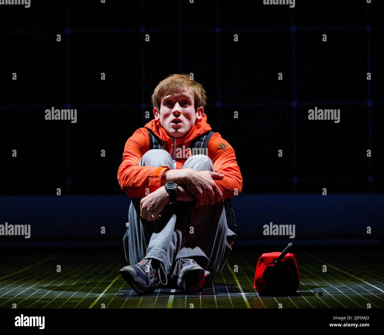 Graham Butler (Christopher Boone) in THE CURIOUS INCIDENT OF THE DOG IN THE NIGHT-TIME by Simon Stephens at the Gielgud Theatre, London W1  08/07/2014 a National Theatre production  adapted from the novel by Mark Haddon  design: Bunny Christie  lighting: Paule Constable  video design: Finn Ross  director: Marianne Elliott Stock Photo