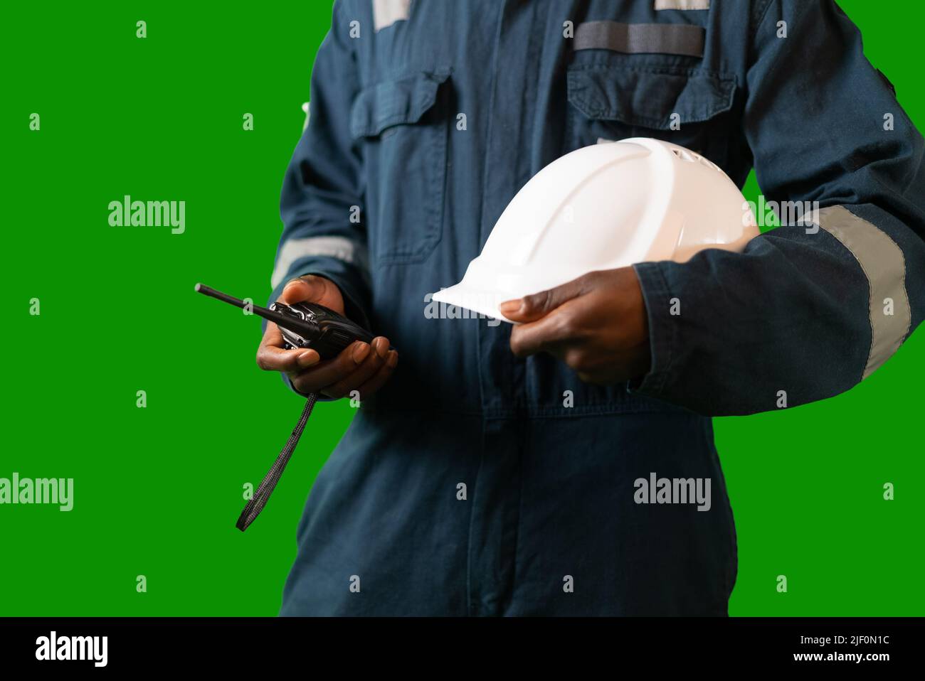 Crop black mariner with hardhat and radio Stock Photo