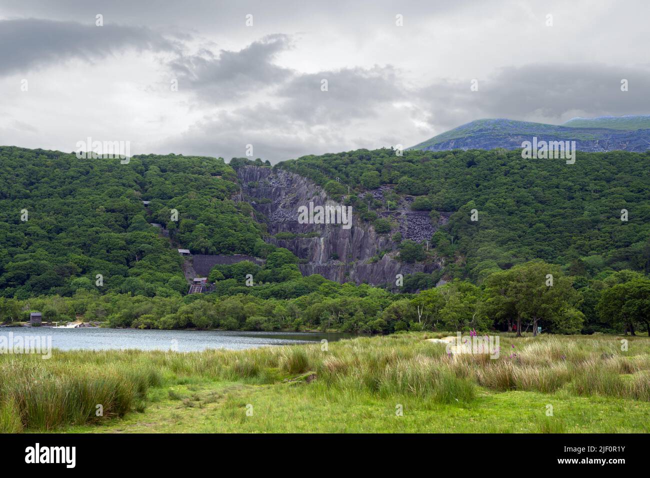 Vivian Slate Quarry is part of the Dinorwic Slate quarries near Llanberis in Snowdonia. It was worked from 1787 to 1960. It became a deep lagoon. Stock Photo