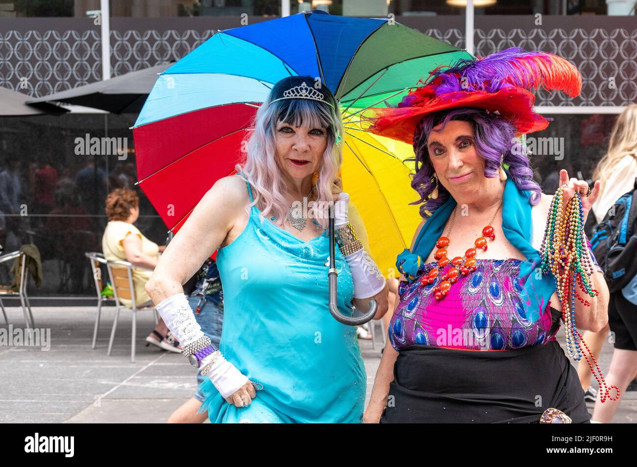 Two senior women in colorful clothes enjoying the Pride Parade celebrations in Bloor Street. Stock Photo