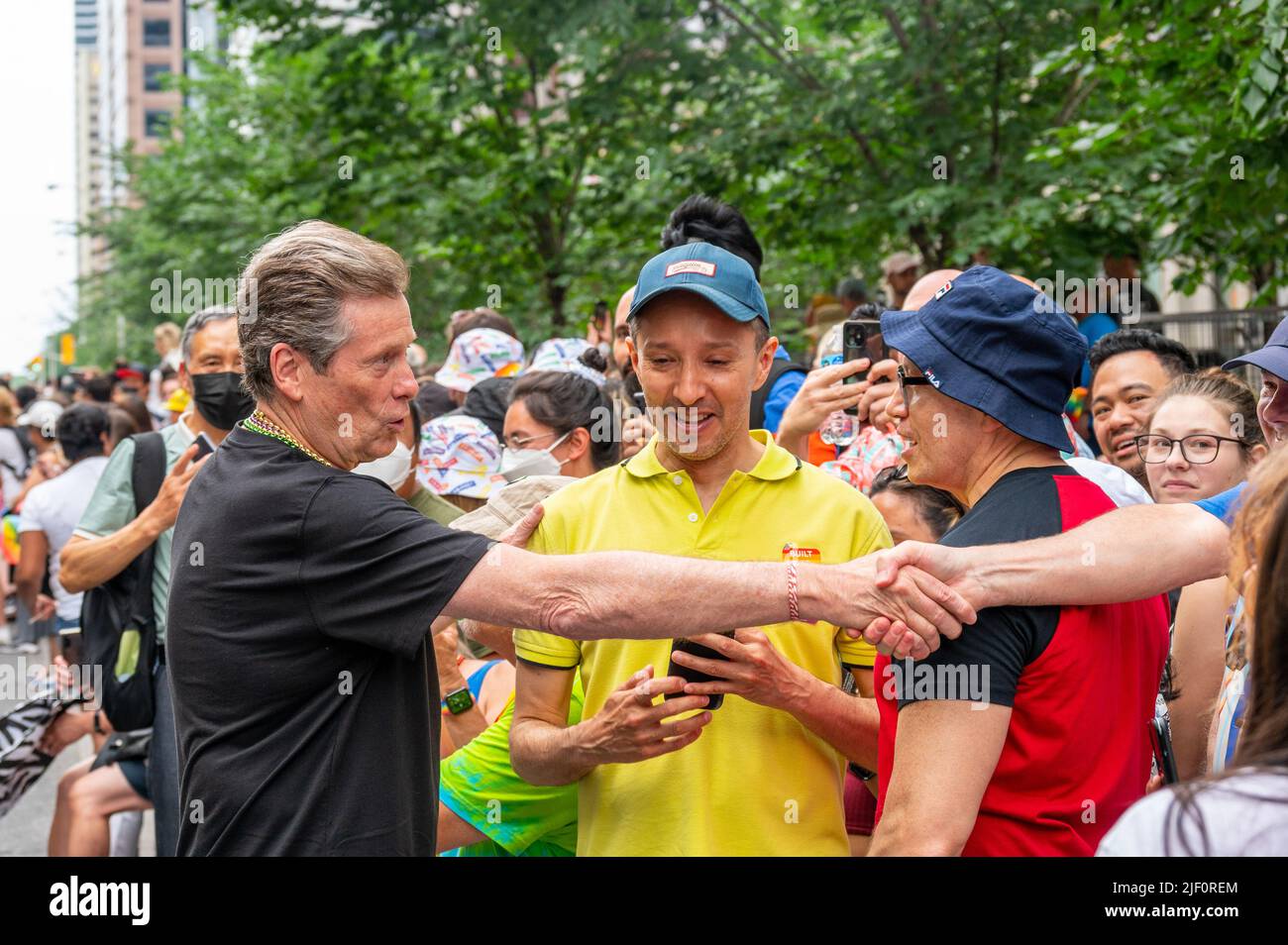 Mayor John Tory handshakes with a member of the public during Pride Parade. Stock Photo