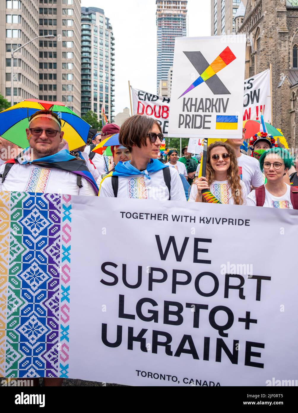 A group of people marching in Pride Parade with signs in support of LGBTQ+ Ukraine Stock Photo