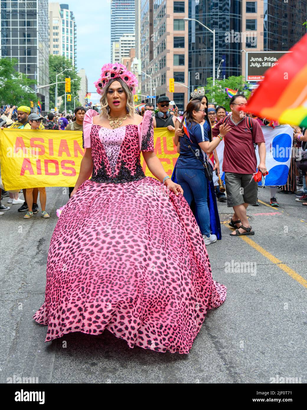 A woman with a pink dress marches in Bloor Street during the Pride Parade. Stock Photo