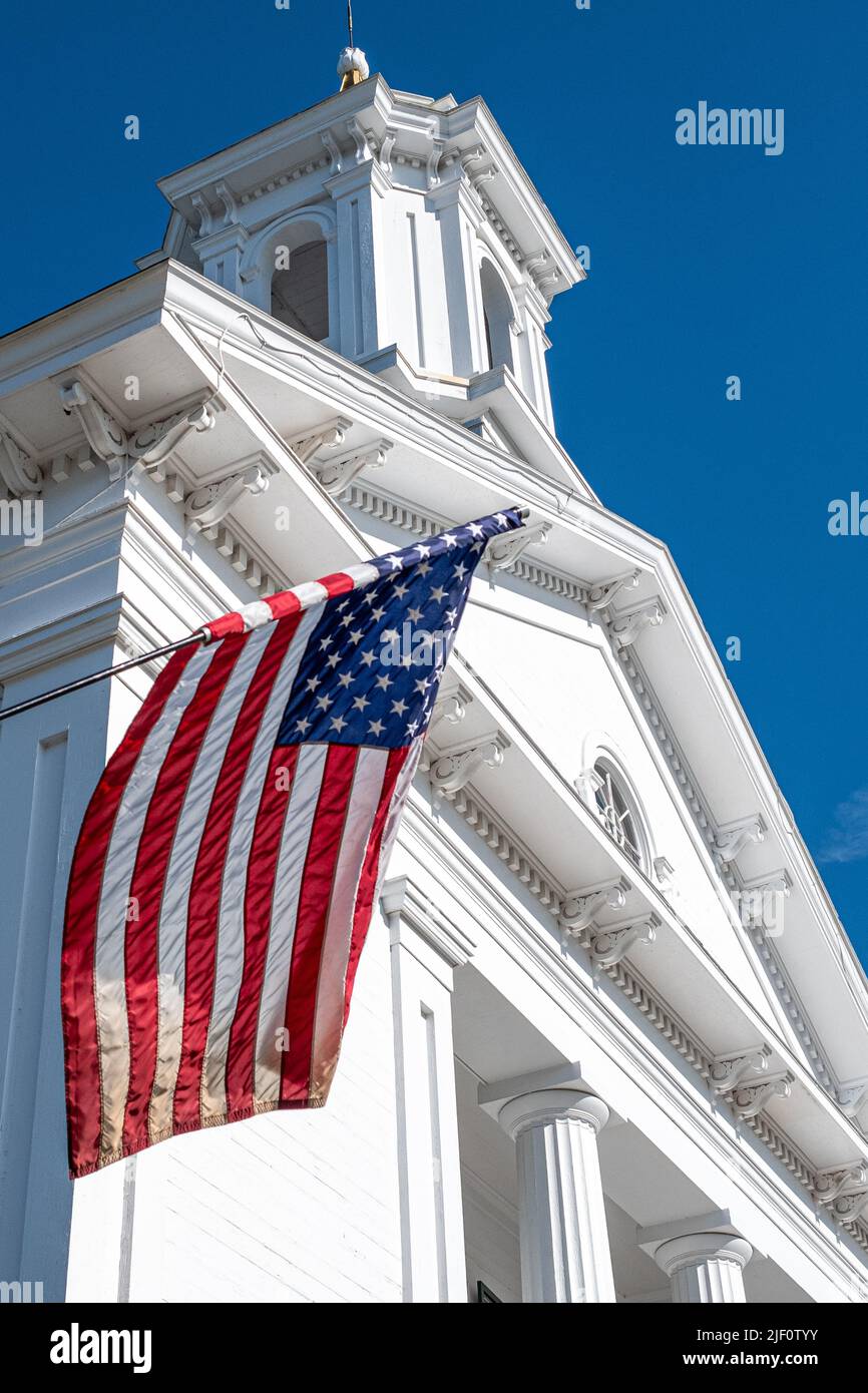 An American Flag flies from the Petersham, MA Town Hall Stock Photo Alamy