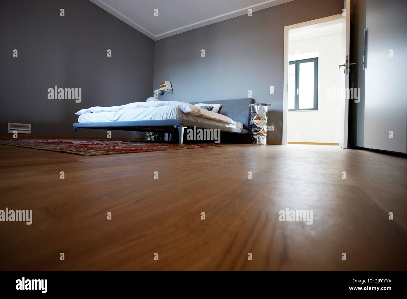 An interior of a bedroom with minimalist furniture Stock Photo - Alamy - Minimalist Bedroom Furniture Installation Using Minimalist Wallpaper