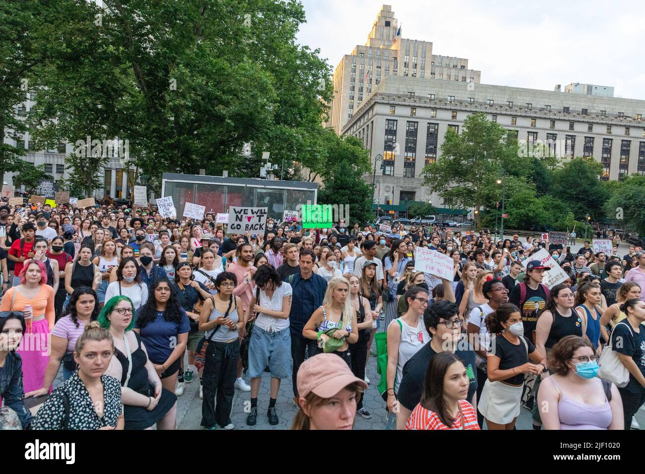 An abortion-rights protest in Foley square New York with the crowd holding cardboard signs Stock Photo