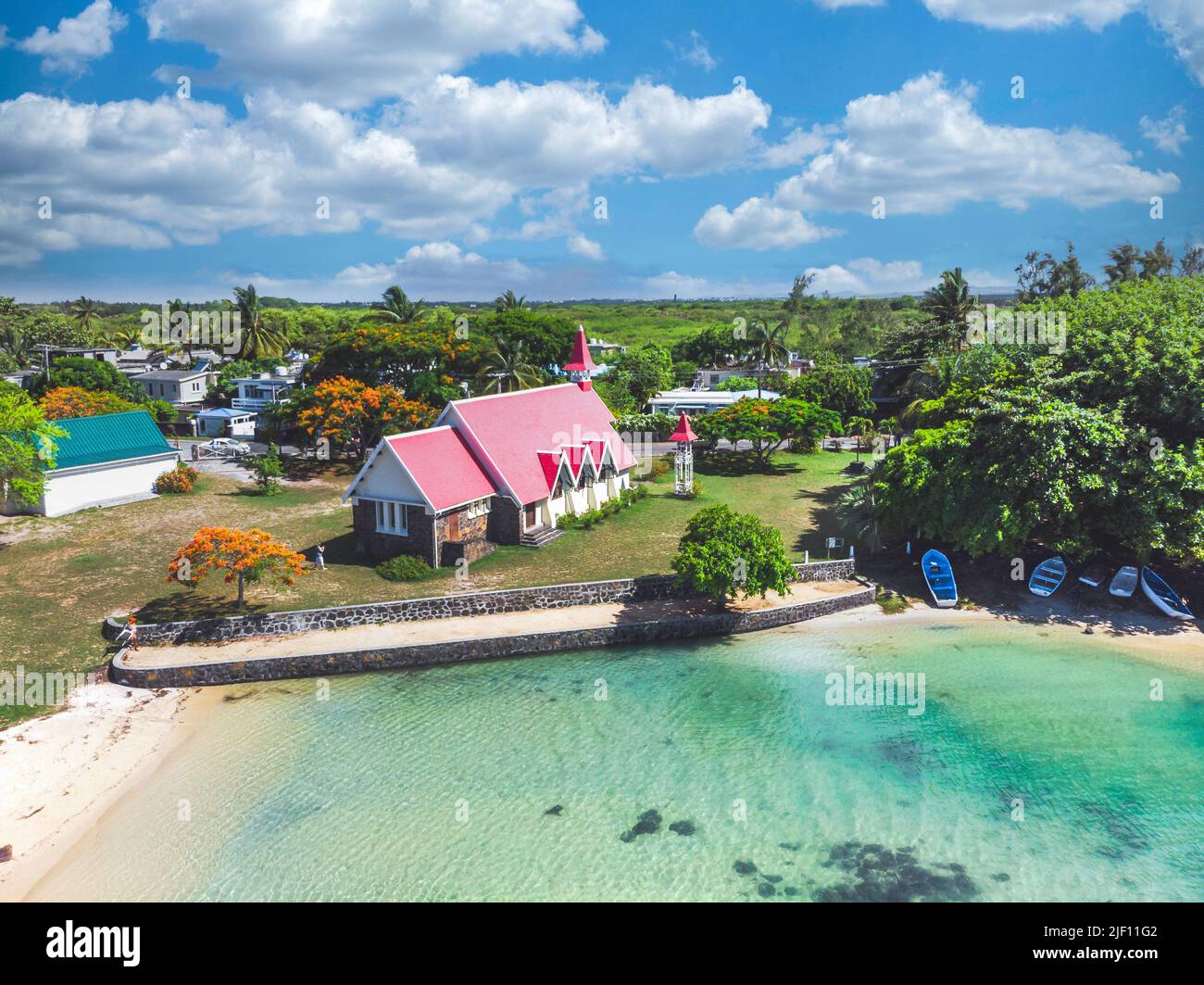 Aerial view of Notre Dame Auxiliatrice Church with distinctive red roof at Cap Malheureux, Mauritius, Indian Ocean Stock Photo
