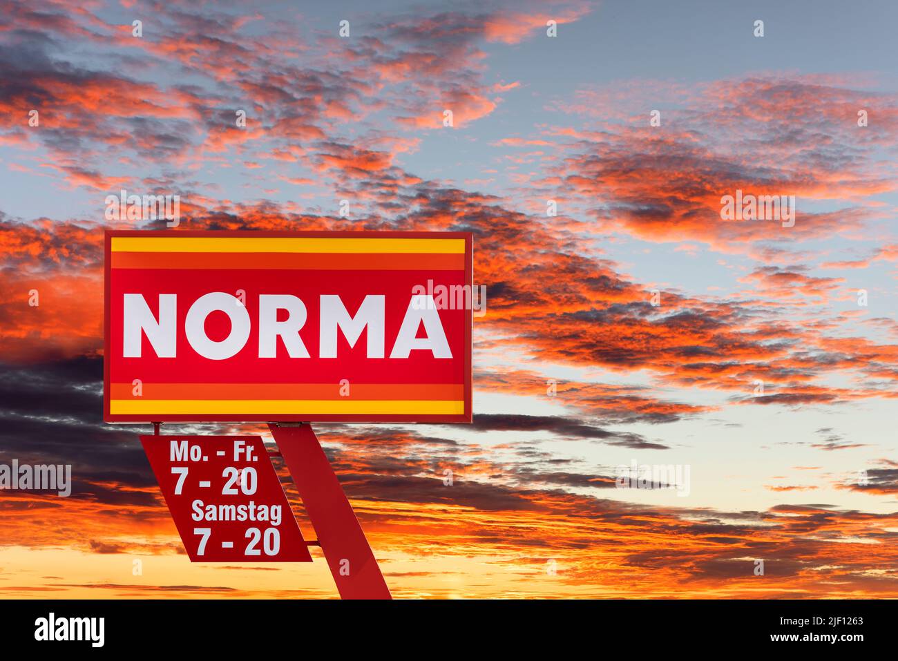 AUGSBURG, GERMANY – JUNE 16, 2022: Advertising sign of the discounter store NORMA in front of a sky with clouds Stock Photo