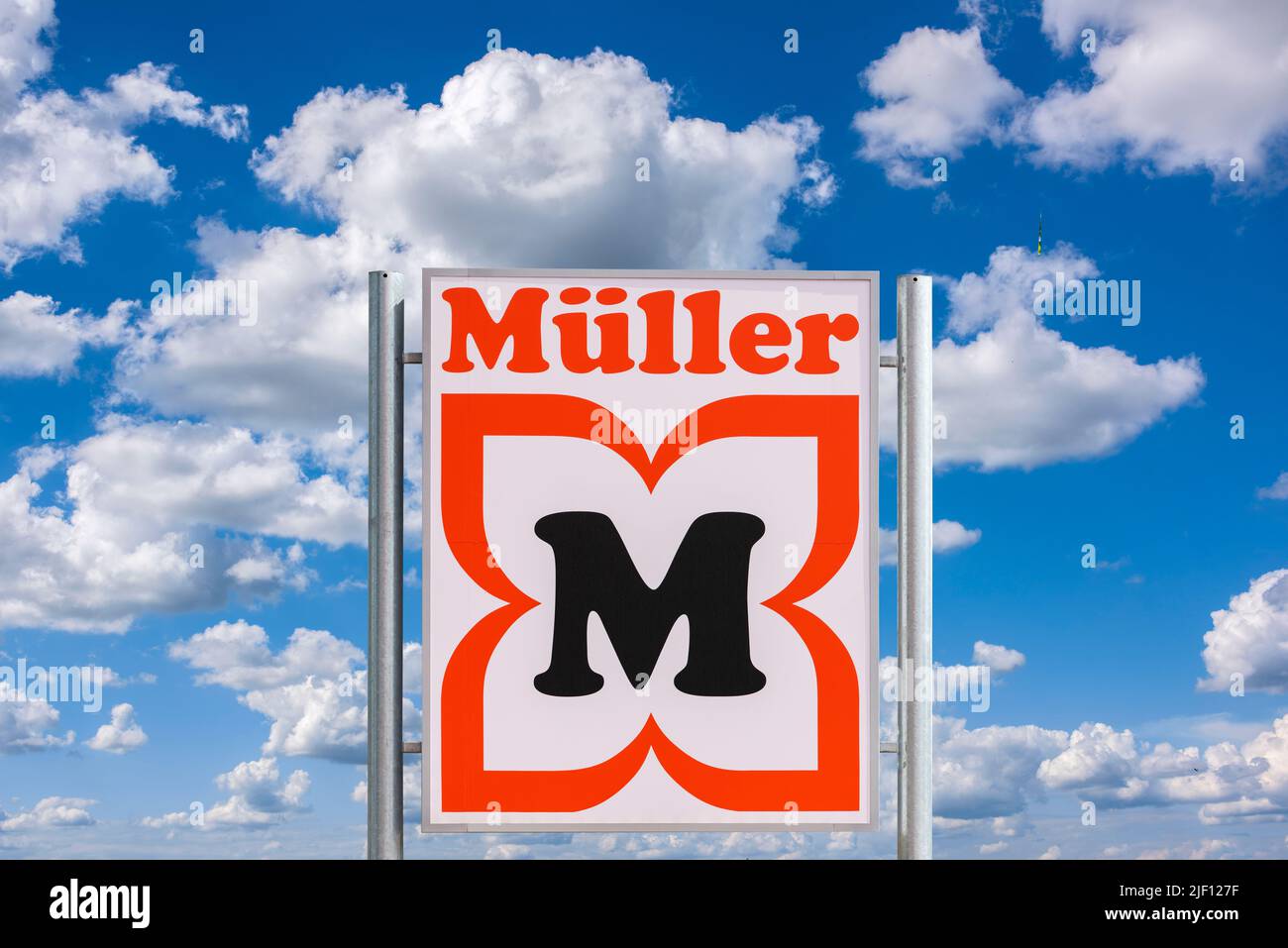 AUGSBURG, GERMANY – JUNE 16, 2022: Advertising sign of the drugstore Müller in front of a sky with clouds Stock Photo