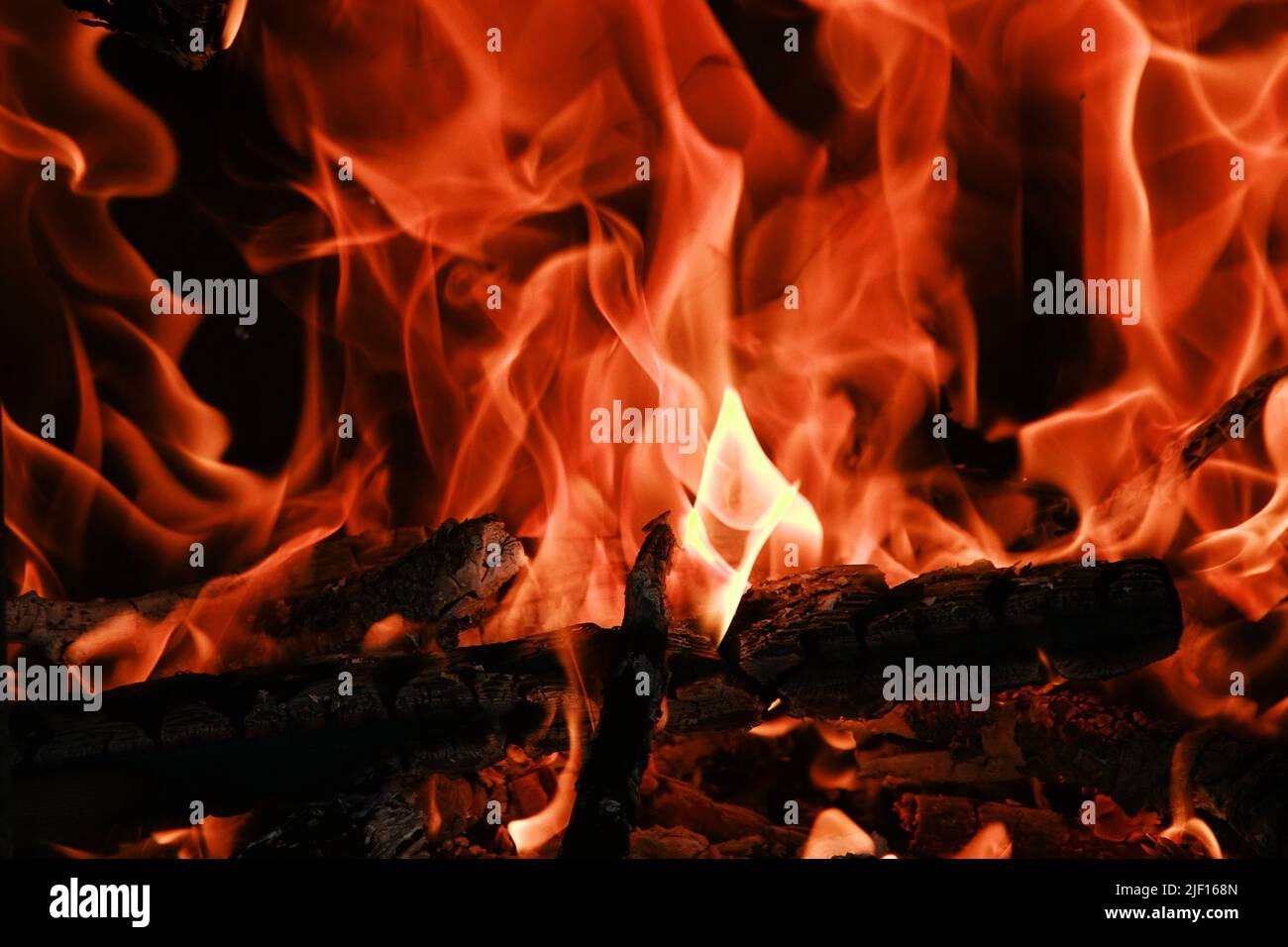 Fire flames from a wood stove fire isolated on a black background Stock