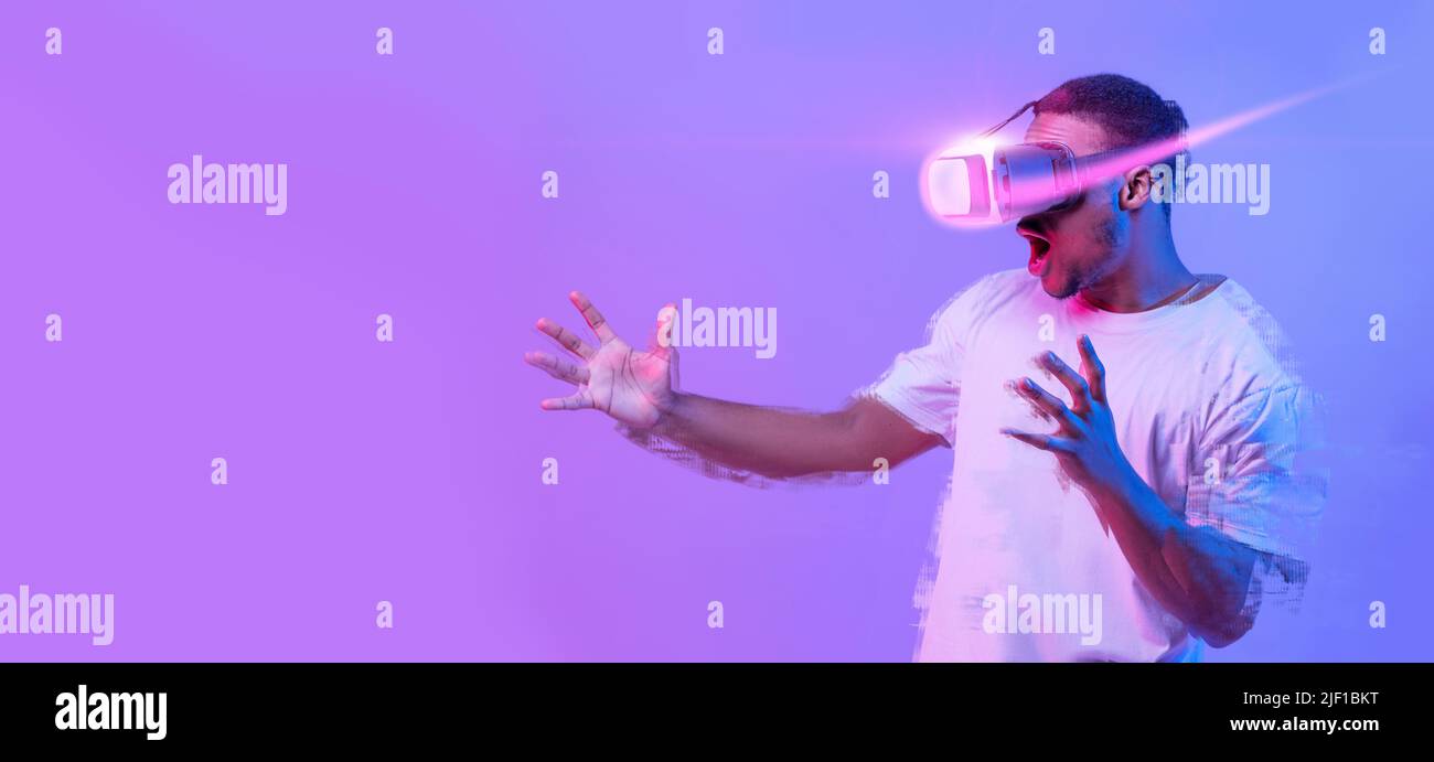 Excited African American Man Playing Video Game In VR Glasses Stock Photo