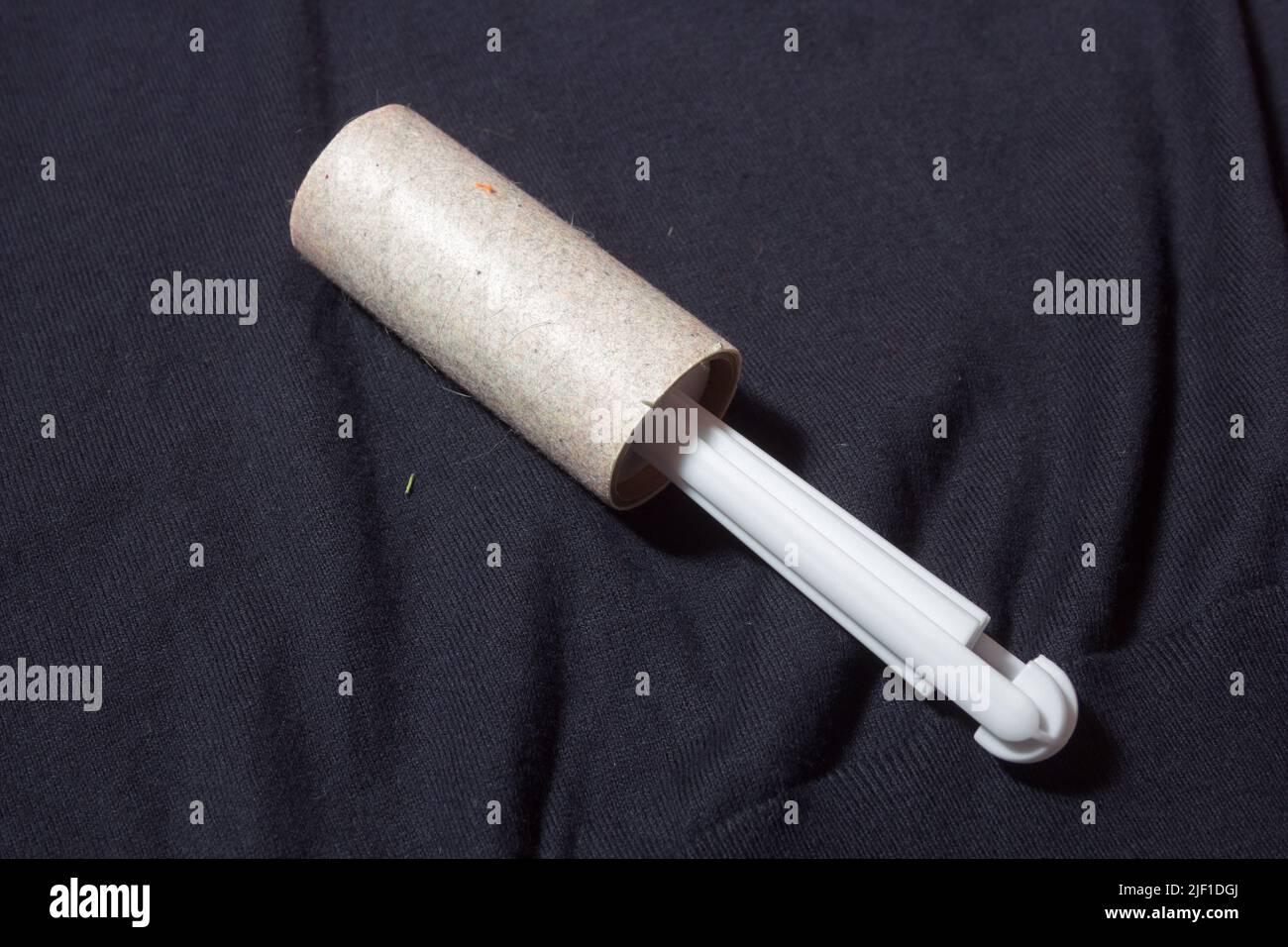 Lint remover on jumper Stock Photo Alamy