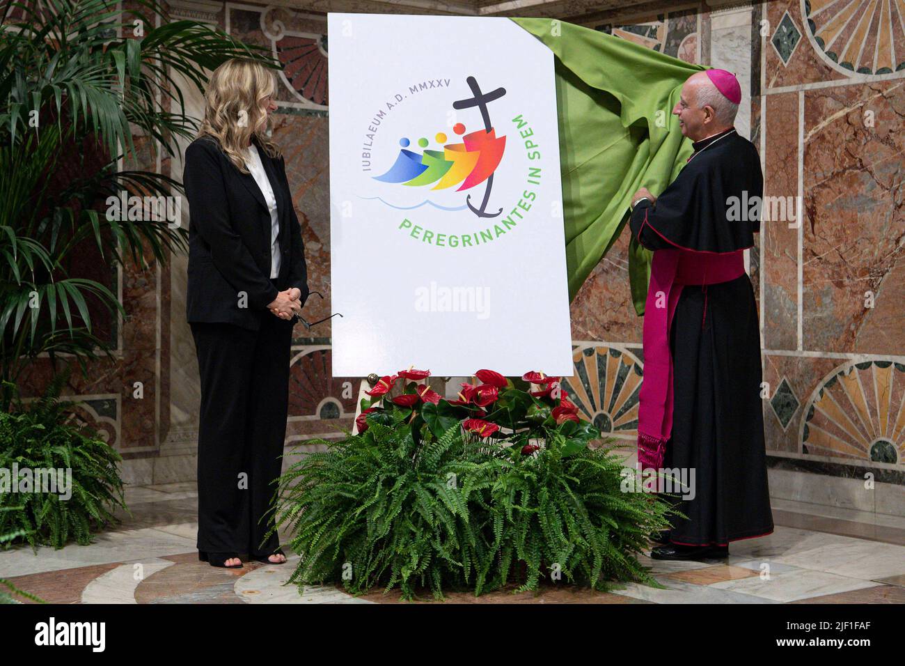 Vatican City, Vatican. 28 June 2022. Monsignor Rino Fisichella (R) Pro-prefect of the Dicastery for Evangelization,  unveils the logo of the Jubilee 2025, MMXXV Pilgrims of Hope, during its presentation at the Regia Hall of the Apostolic Palace. (Photo by Vatican Media). Credit: Vatican Media/Picciarella/Alamy Live News Stock Photo
